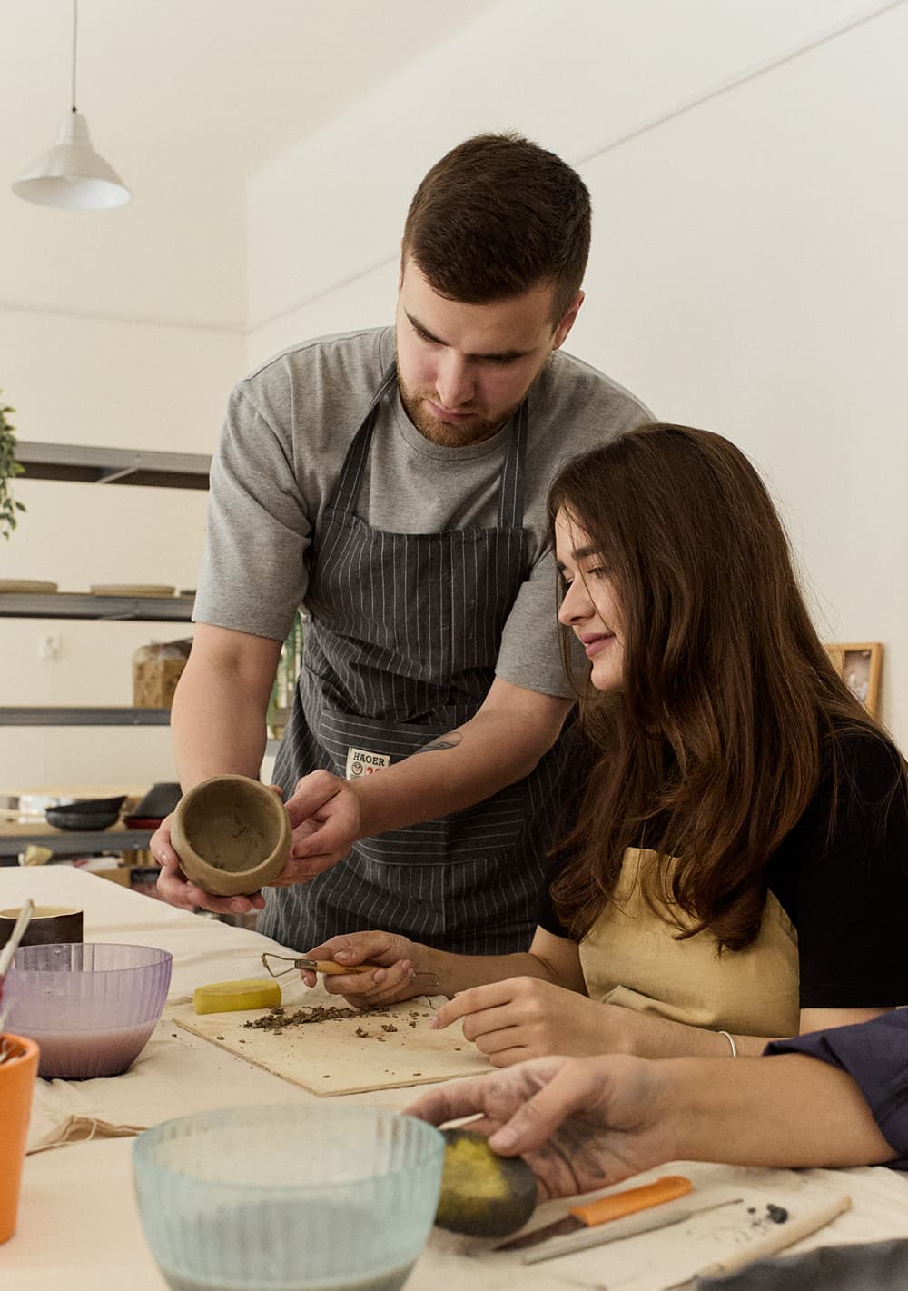 People enjoying pottery workshop